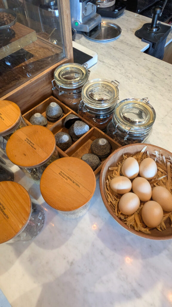 John Hardy Seminyak Jamu Bar counter with a bowl of eggs and custom pinch bowls made in patnership with Gaia Ceramics.