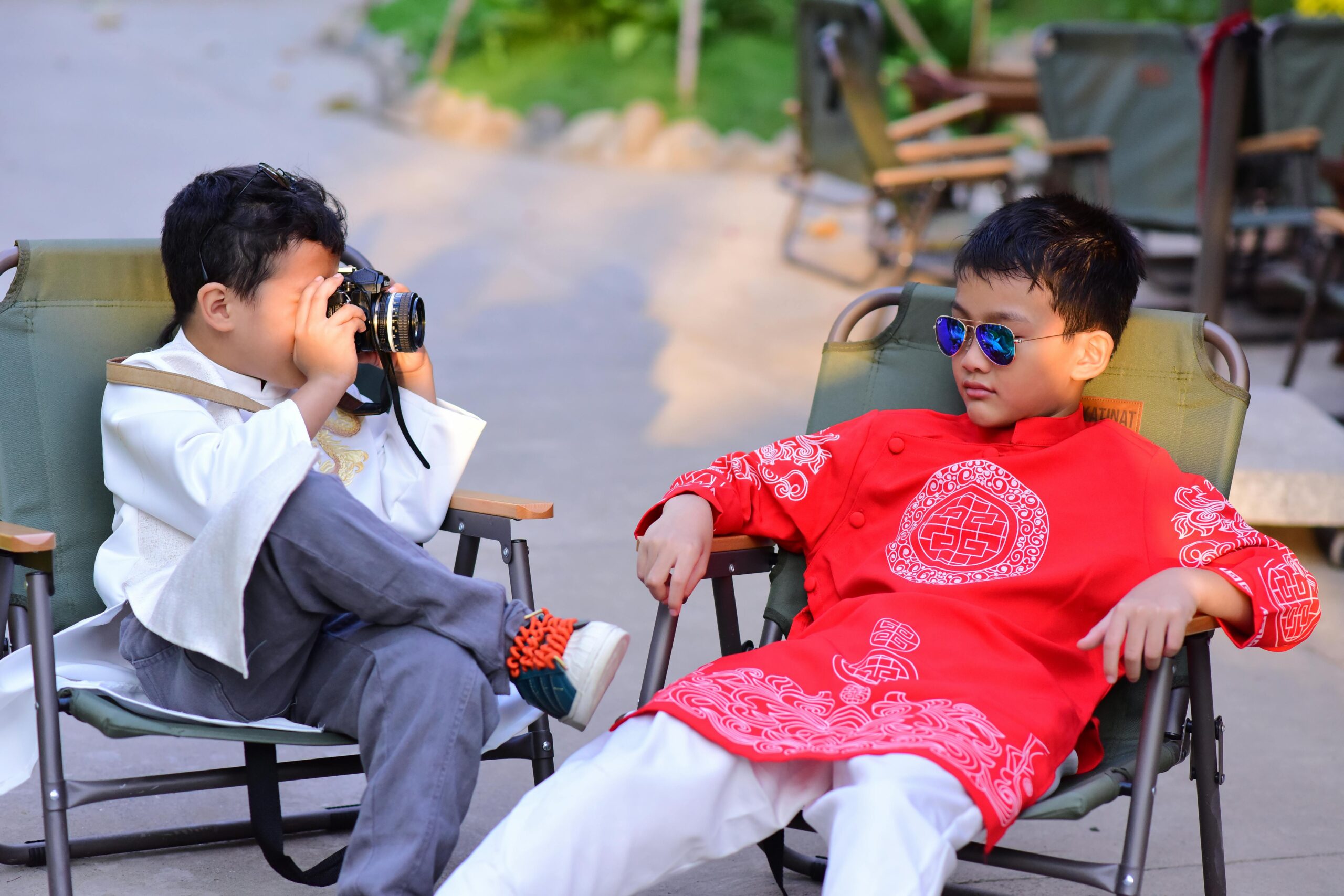 Two Asian boys lounging and being silly
