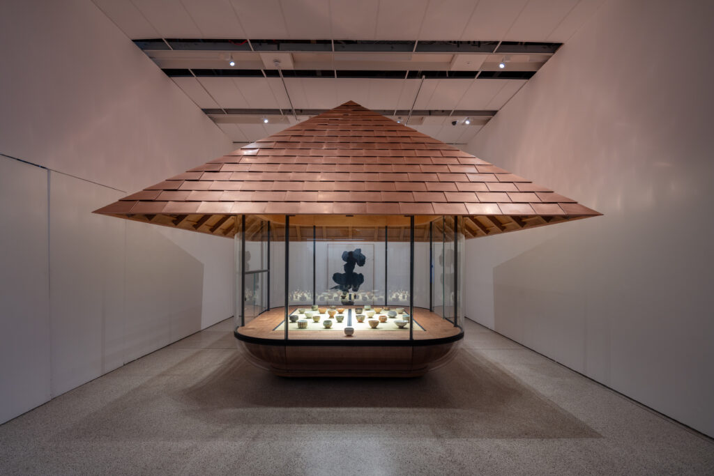 NIGO: From Japan with Love closes with a custom-made chashitsu by NOT A HOTEL. It houses 25 of Nigo's hand-thrown chawan and is backdropped by a painting that reads "老" or "old age" by late calligrapher Yūichi Inoue.