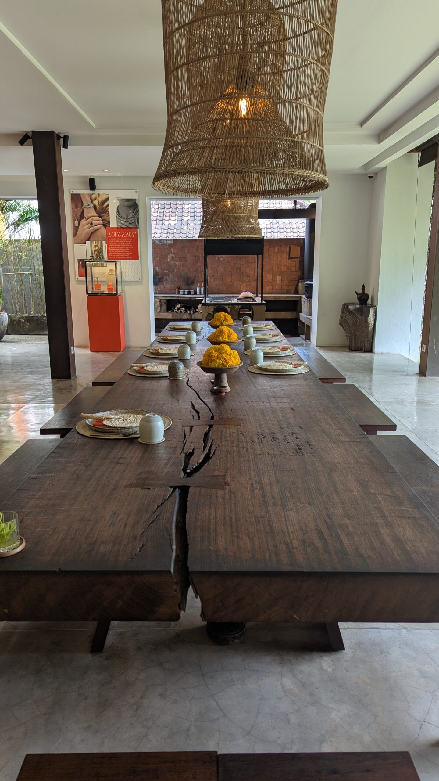 John Hardy Seminyak long table and woodfire grill set to serve their daily communal meals.
