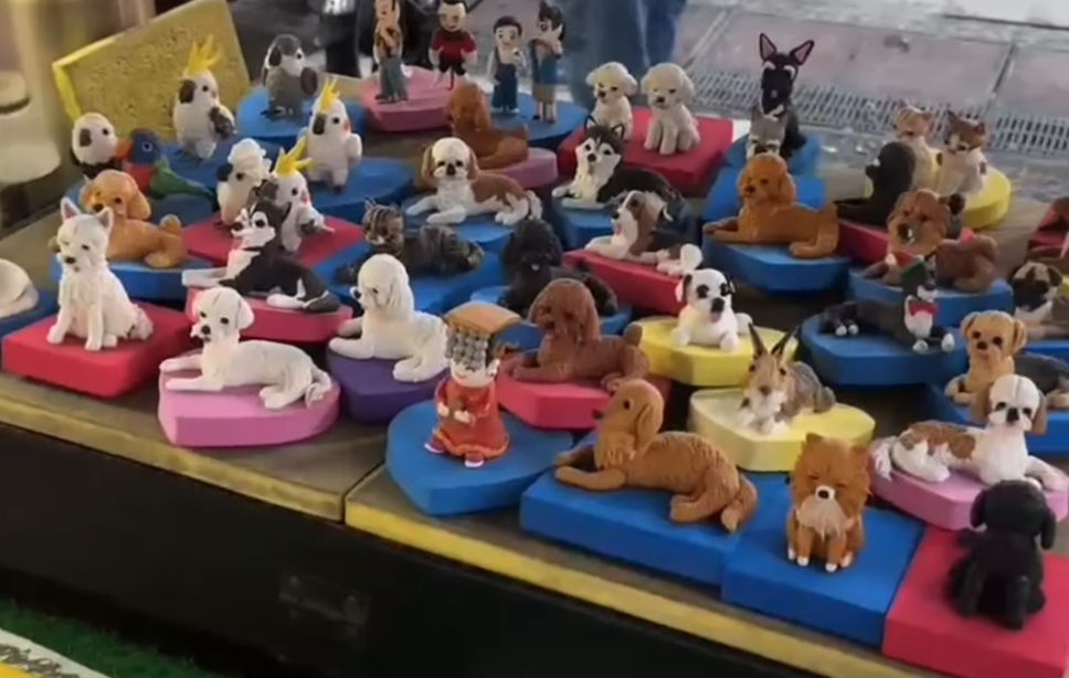 Clay pet figurines by a street artist in Ximendong, Taipei.